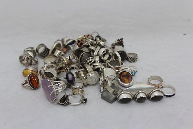 Appraisal: A COLLECTION OF CONTEMPORARY SILVER RINGS inset with semi precious