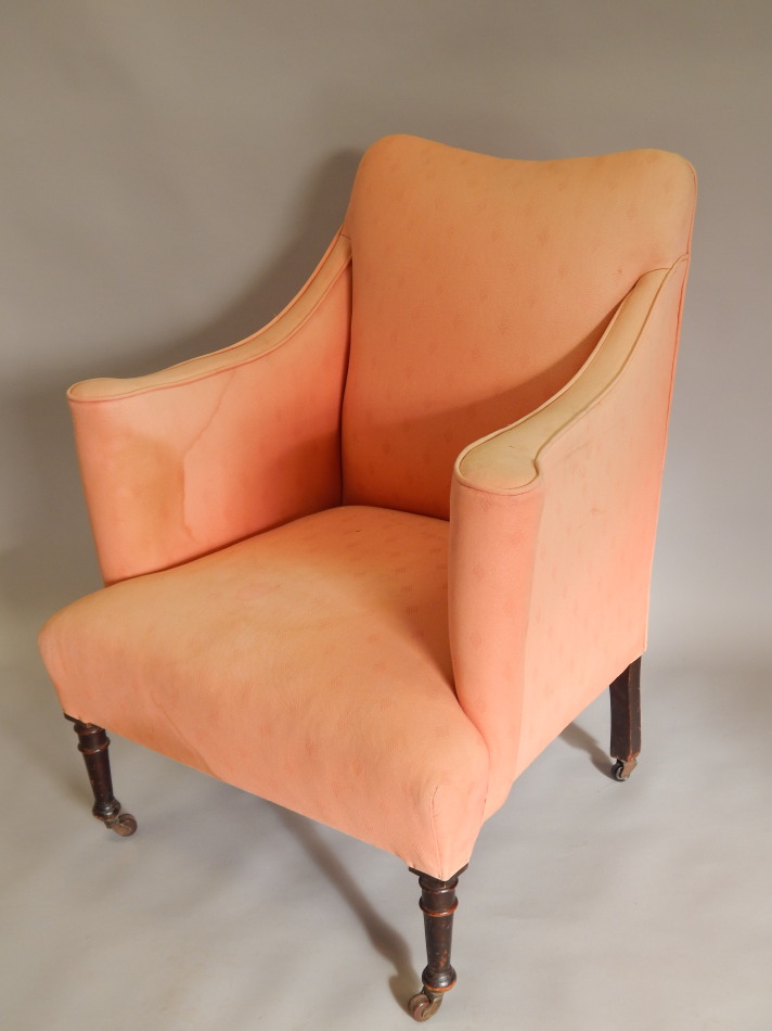 Appraisal: A thC mahogany armchair with a padded back arms and