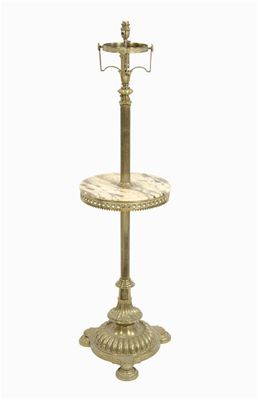 Appraisal: An adjustable brass standard lamp the reeded stem to a