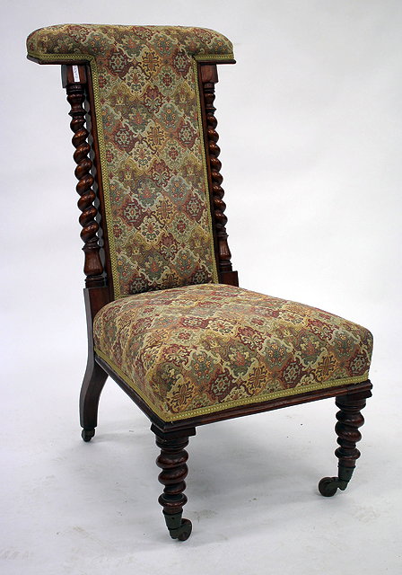 Appraisal: A VICTORIAN WALNUT FRAMED PRIE-DIEU UPHOLSTERED CHAIR with barley twist