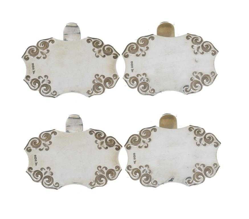 Appraisal: A SET OF FOUR EDWARD VII PATENT CLIP ON SAUCER