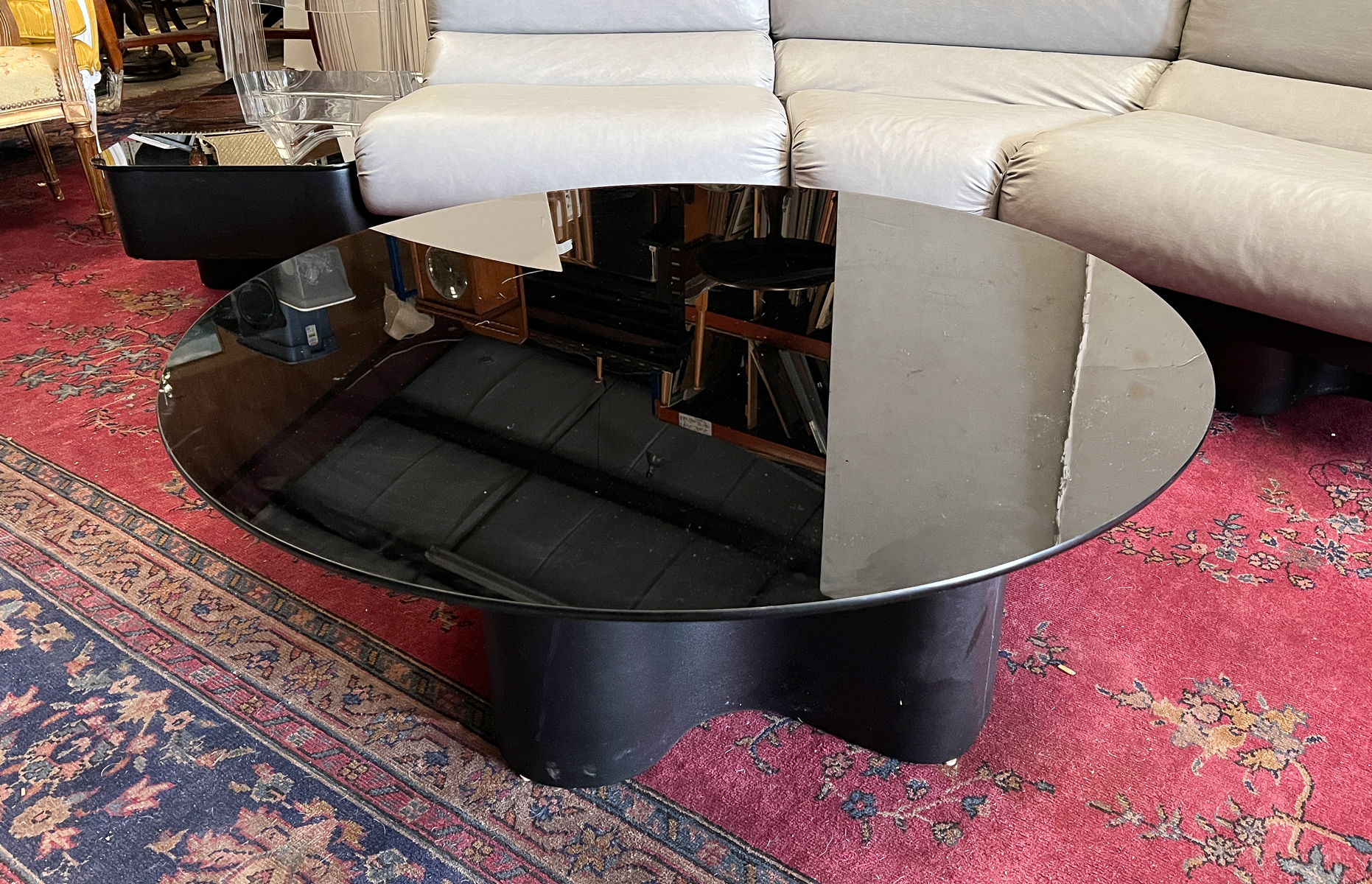 Appraisal: MODERN BLACK GLASS TOP COFFEE TABLE Round black glass top