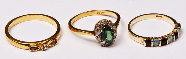 Appraisal: A COLLECTION OF THREE RINGS including an opal and ruby