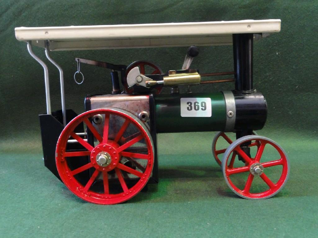 Appraisal: A Mamod steam driven tractor with oil drum and water