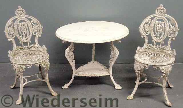 Appraisal: Cast aluminum Victorian style round table and two matching side