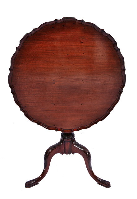 Appraisal: A CHIPPENDALE STYLE MAHOGANY PIE CRUST OCCASIONAL TABLE on fluted