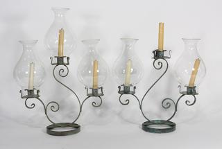 Appraisal: Pair of patinated iron candelabra each with three single lights