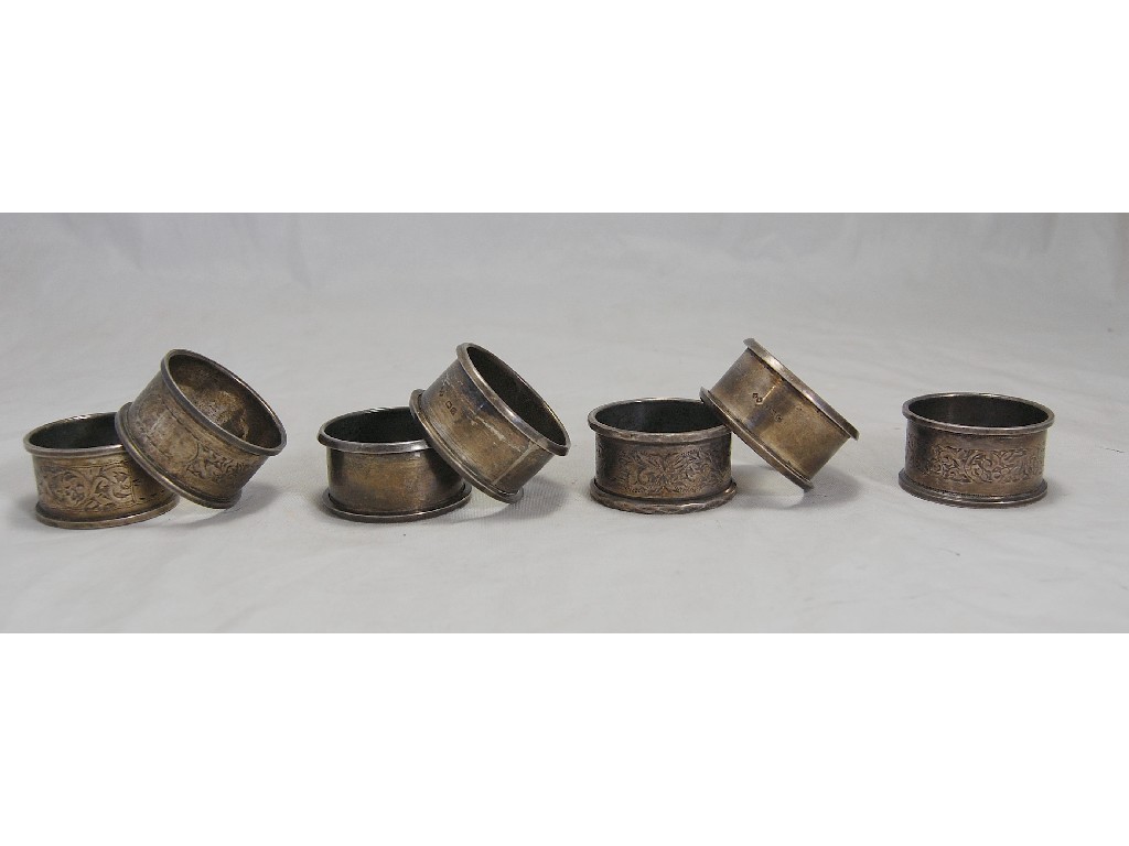 Appraisal: Two sets of three silver napkin rings and a single