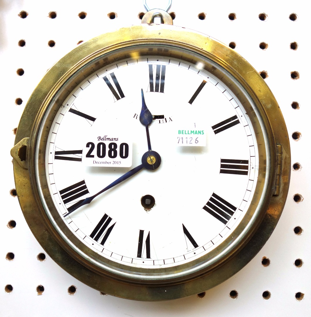 Appraisal: A brass cased dial clock late th century with white