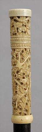 Appraisal: WOOD WALKING STICK WITH CHINESE CARVED IVORY HANDLE The cylindrical