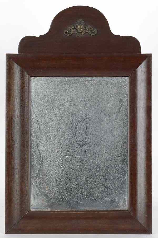 Appraisal: Stained poplar mirror th c with applied cherub on crest