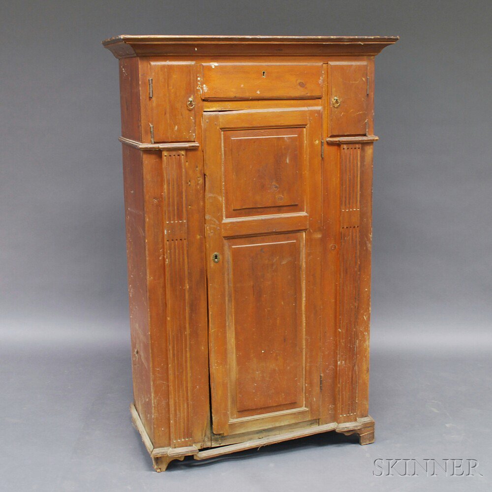 Appraisal: Country Pine Paneled One-door Cupboard America th century the molded