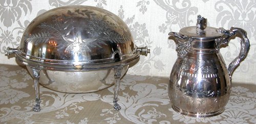 Appraisal: Title Silver Plated Pitcher with vine handle and mask spout