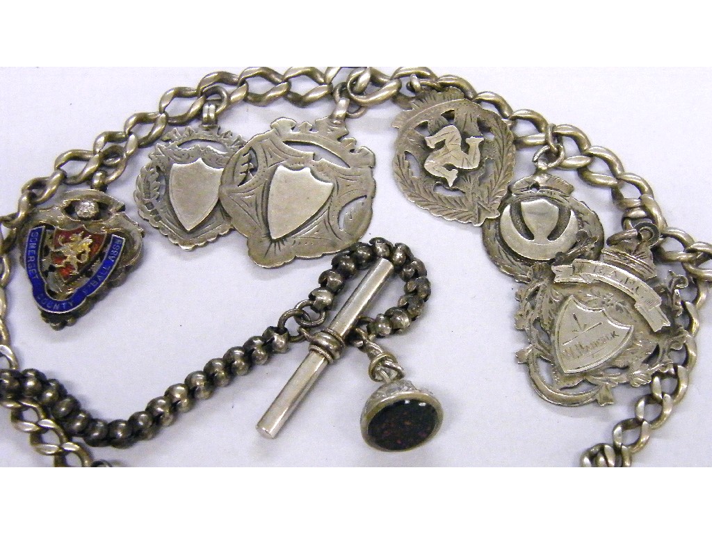 Appraisal: Silver graduated curb link albert with six silver medallions long