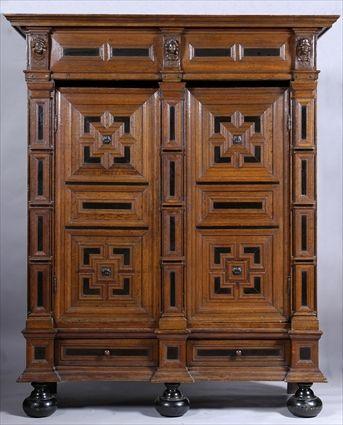 Appraisal: NORTHERN EUROPEAN BAROQUE EBONY-MOUNTED OAK THREE-PART SHRANK The molded overhang