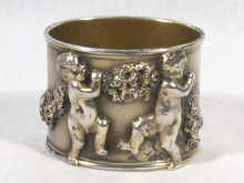 Appraisal: Russian Interest An extremely fine napkin ring with raised putti