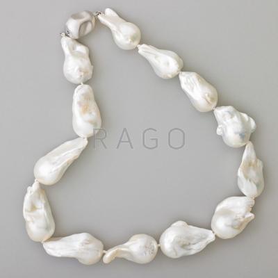 Appraisal: BAROQUE WHITE SOUTH SEA PEARL NECKLACE Thirteen asymmetric comet-shaped pearls