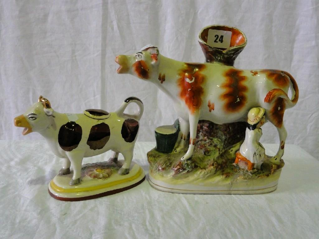 Appraisal: A th century Staffordshire cow creamer with lustred patches with