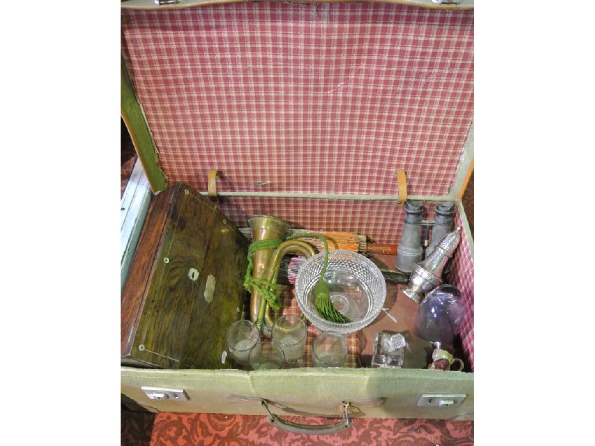 Appraisal: A vintage canvas travelling trunk containing a miscellaneous collection to