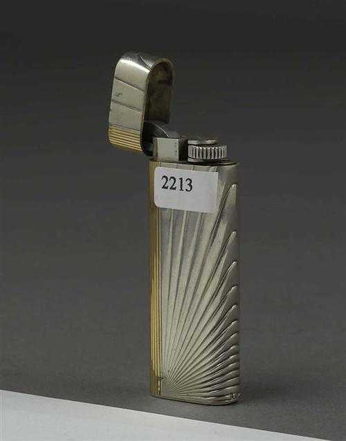 Appraisal: LIGHTER CARTIER Silver Gas lighter the housing with a ray-shaped