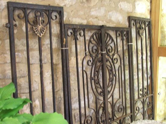 Appraisal: A PAIR OF WROUGHT IRON GARDEN GATES with side panels