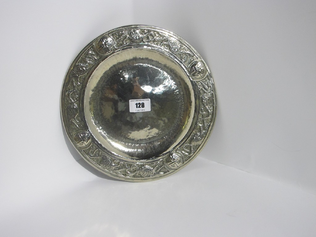 Appraisal: A circular white metal salver embossed with mythical birds and