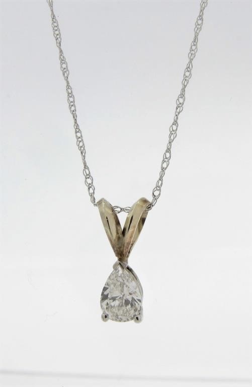 Appraisal: A K white gold solitaire pendant featuring an approximately ct