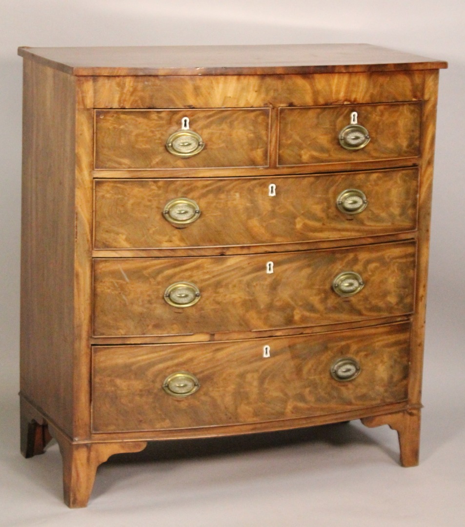 Appraisal: An early thC bow fronted mahogany chest of two short