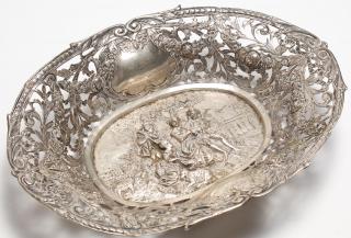 Appraisal: Ornate European Silver Figural Bread Basket Centered around a repousse