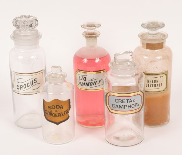 Appraisal: Apothecary jars with glass stoppers and labels Tallest including stopper