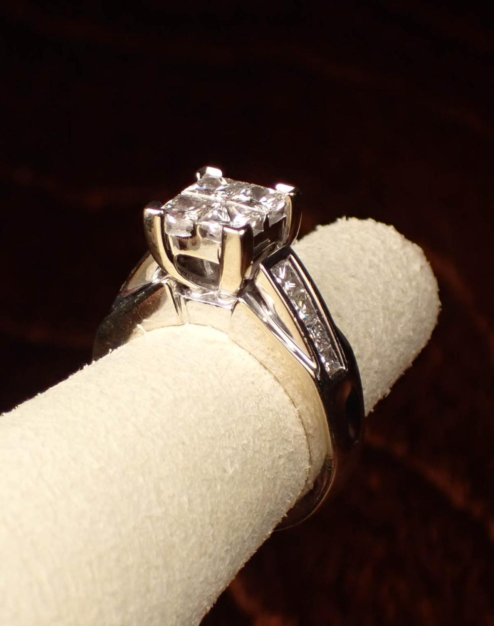 Appraisal: DIAMOND AND FOURTEEN KARAT WHITE GOLD RING with four graduated