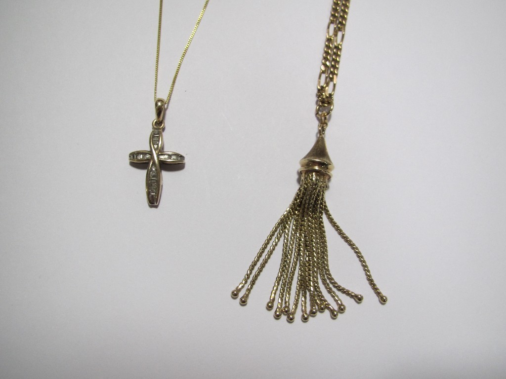 Appraisal: A baguette diamond set pendant and a tassel pendant both