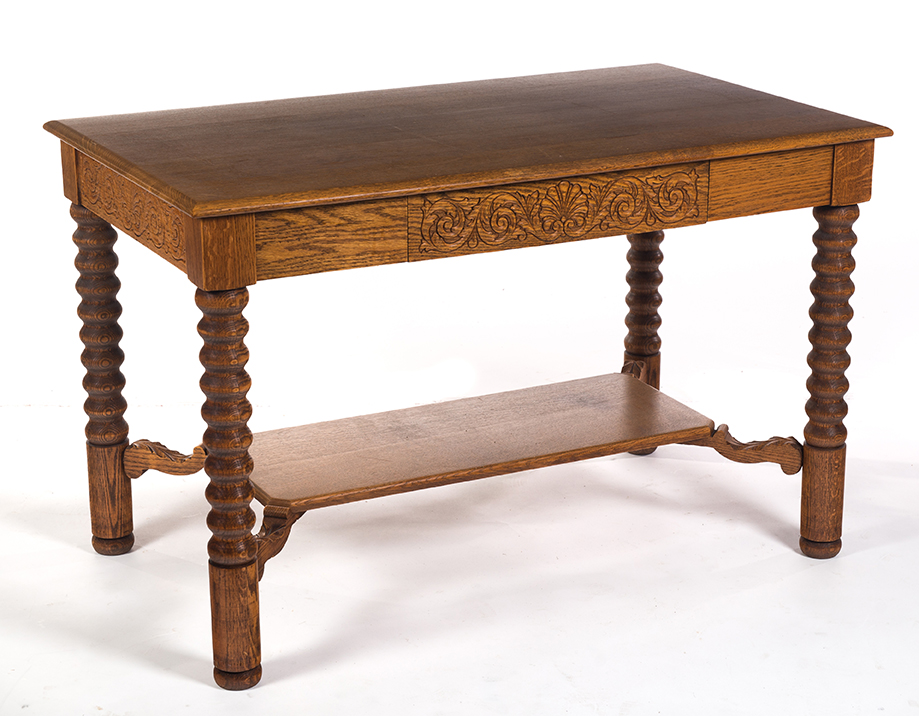 Appraisal: QUARTER-SAWN OAK LIBRARY TABLE American ca Pressed carved skirt spool