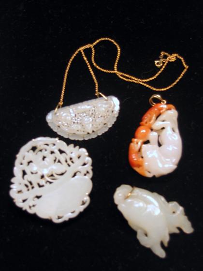 Appraisal: Four Chinese white jade pendants mostly th century Comprising of