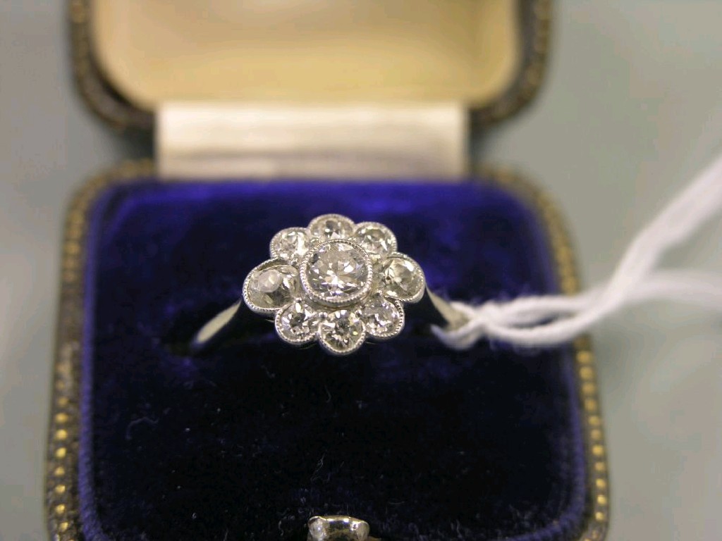 Appraisal: An ct white gold diamond cluster ring nine stone daisy