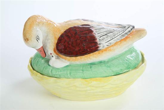 Appraisal: STAFFORDSHIRE DUCK ON NEST A polychrome duck and white duckling