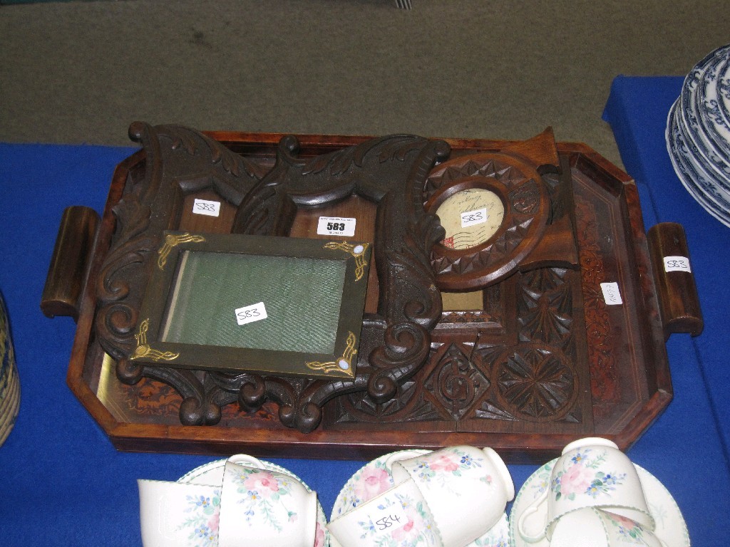 Appraisal: Five carved wooden photo frames a tray and a Scottish