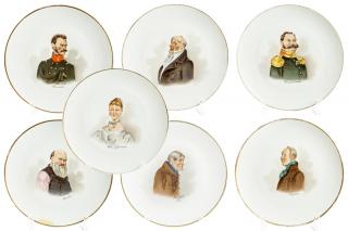 Appraisal: A RARE SET OF SEVEN CHARGER PLATES WITH CHARACTERS FROM