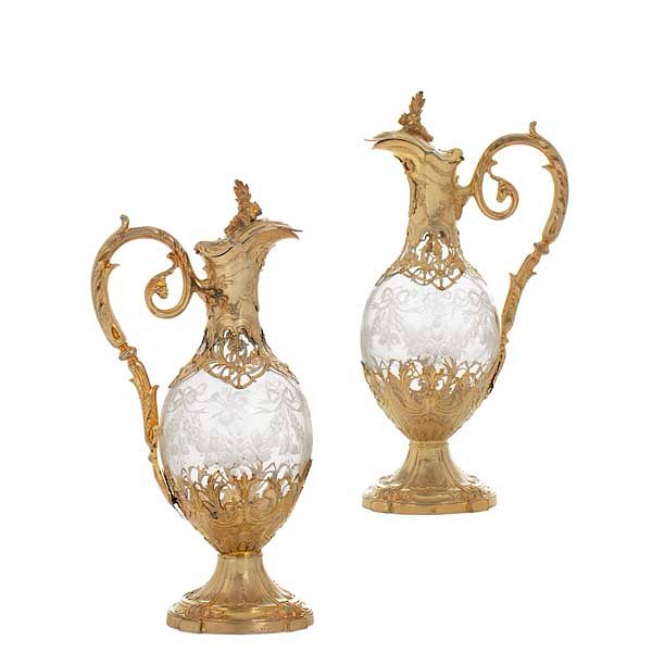 Appraisal: A pair of French silver glass claret jugs A pair