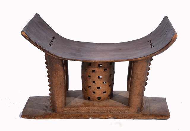 Appraisal: AN ASHANTI CARVED WOODEN 'QUEEN MOTHER' STOOL with pierced and