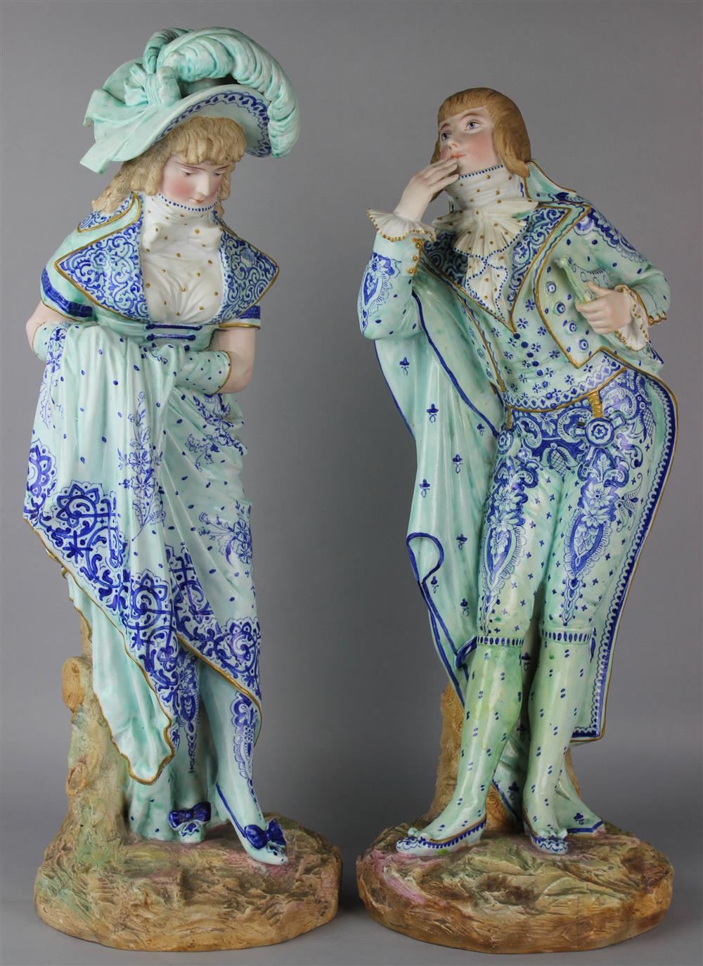 Appraisal: PAIR OF FRENCH ENAMELED BISQUE PORCELAIN FIGURES OF A LADY