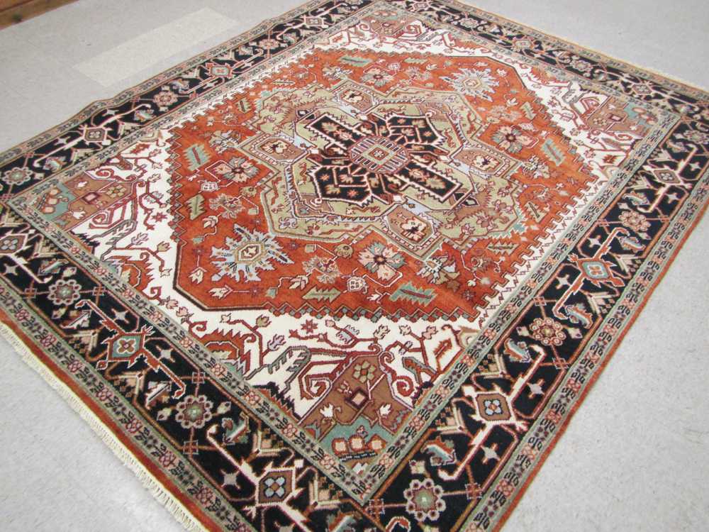 Appraisal: HAND KNOTTED ORIENTAL CARPET Persian Serapi design composed of central