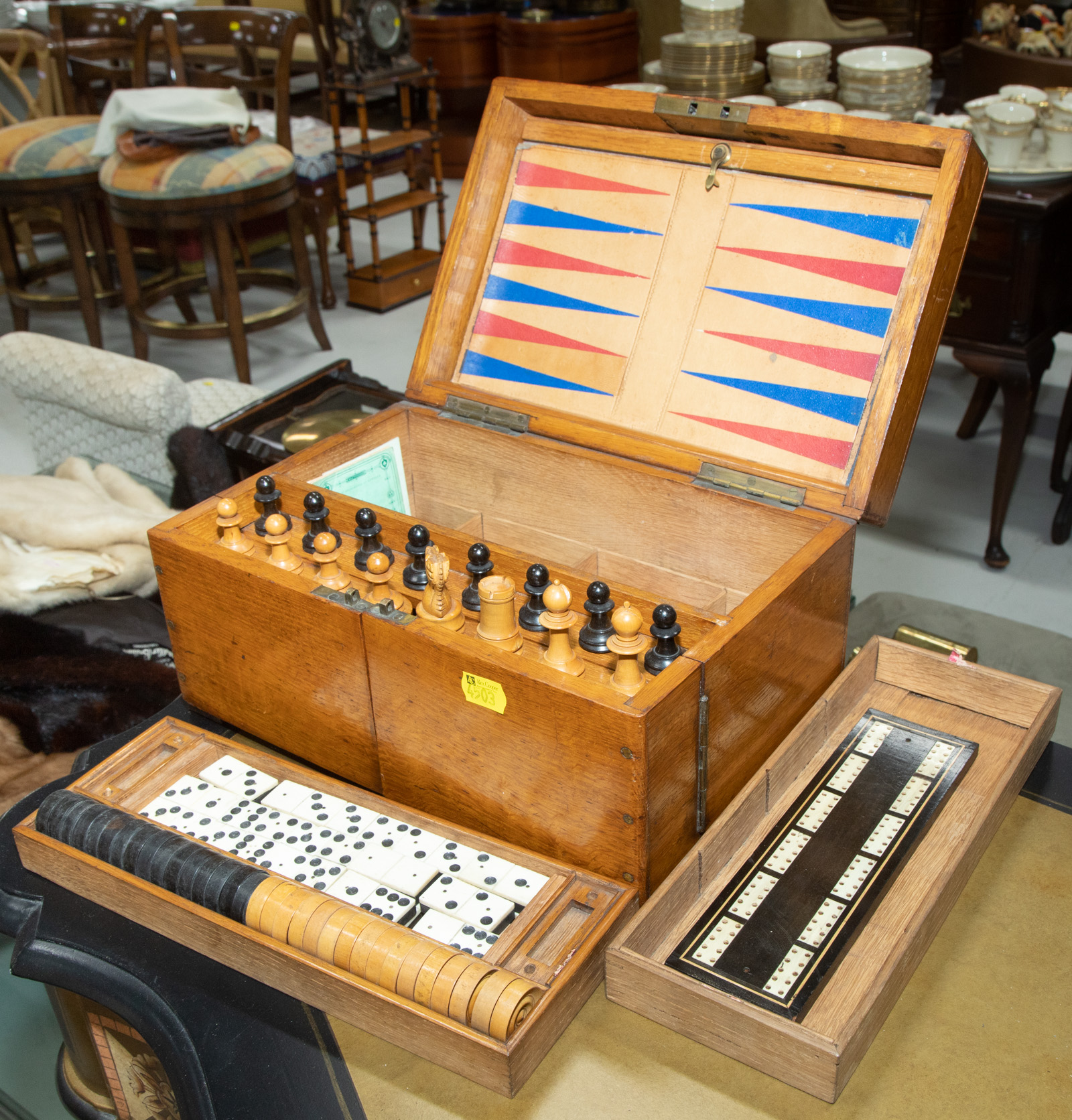 Appraisal: ANTIQUE OAK BOXED GAMES SET Includes complete chess pieces dominoes