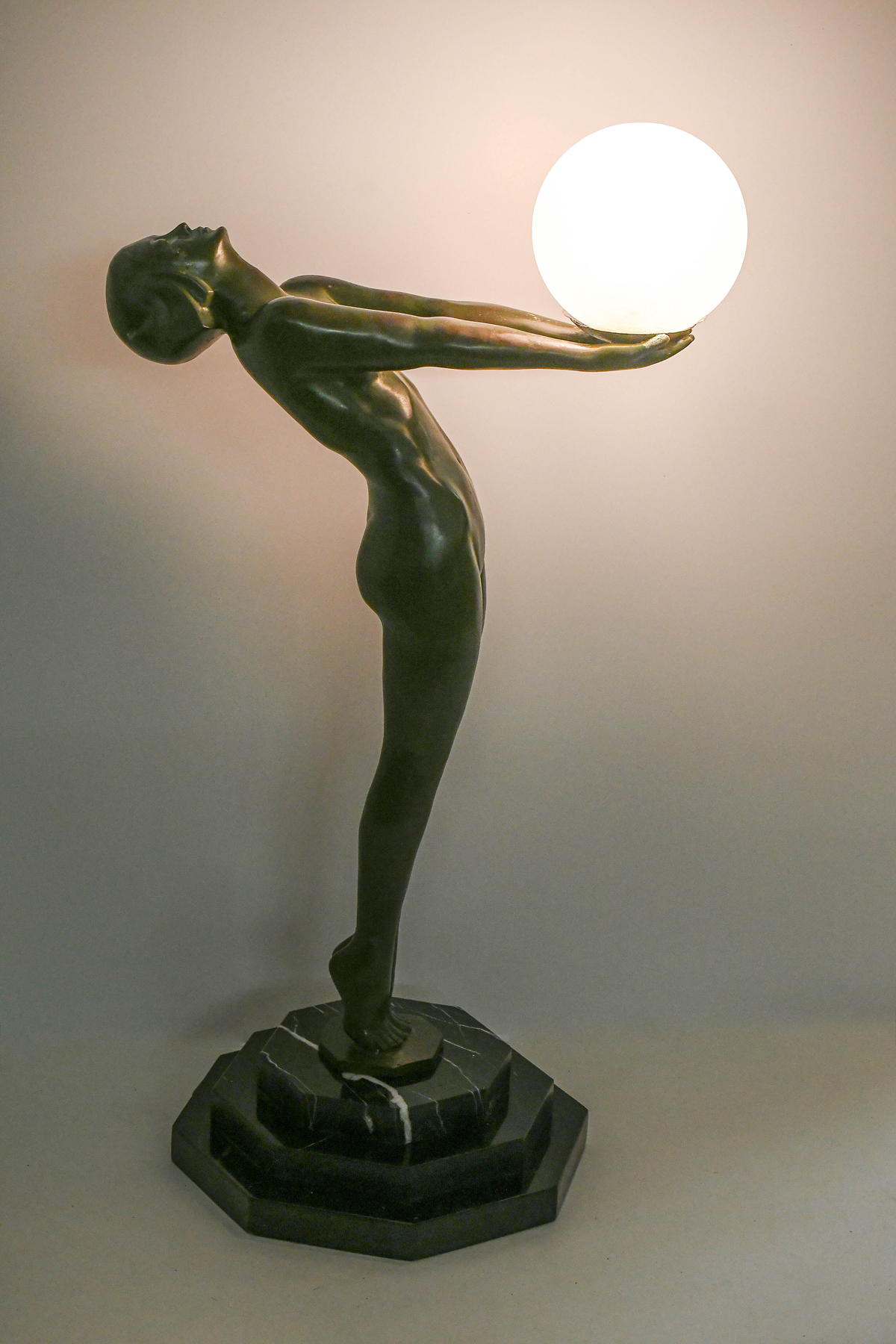 Appraisal: ART DECO STYLE NUDE LAMP WITH BALL SHADE Ball form