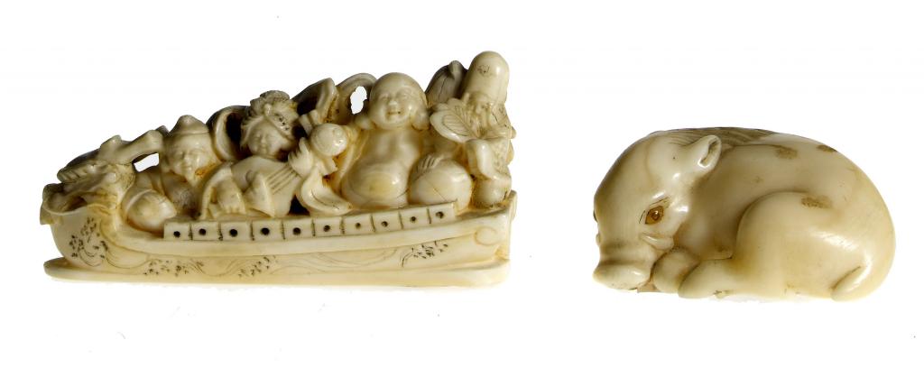 Appraisal: TWO IVORY NETSUKE one of a wild boar Inoshishi with