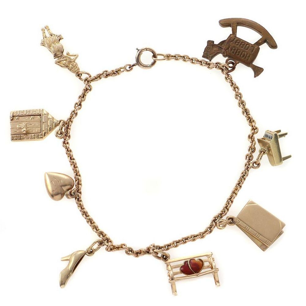 Appraisal: k gold charm bracelet suspending seven k and one metal