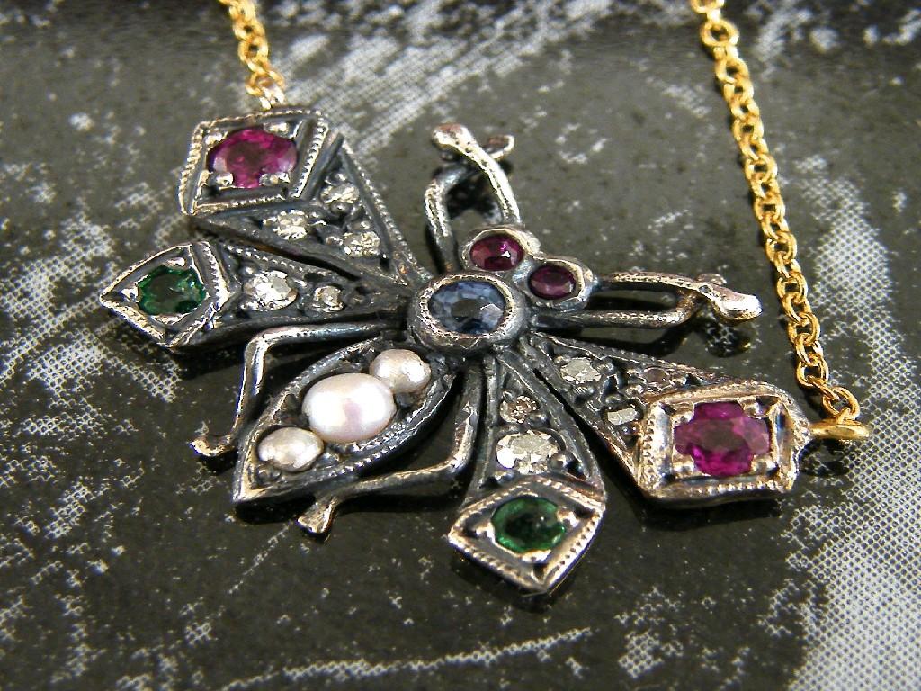 Appraisal: Attractive emerald ruby and pearl butterfly pendant on an ct