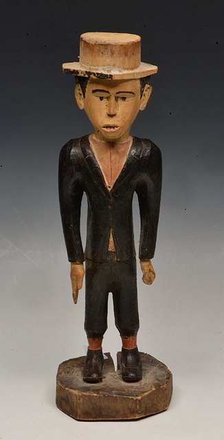 Appraisal: A TH CENTURY YOMBE CARVED WOOD FIGURE of a colonial