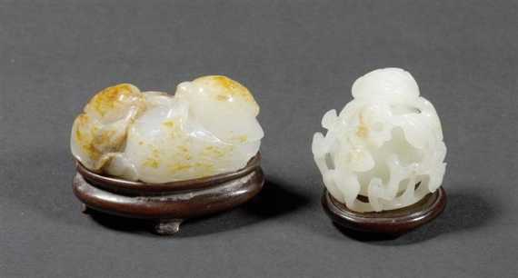 Appraisal: TWO WHITE AND PALE JADE CARVINGS WITH RUSSET INCLUSIONS China