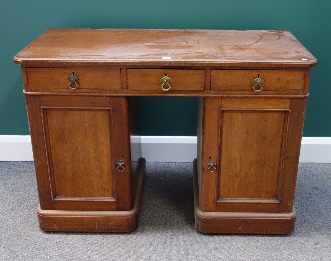 Appraisal: A th century mahogany pedestal desk with three frieze drawers